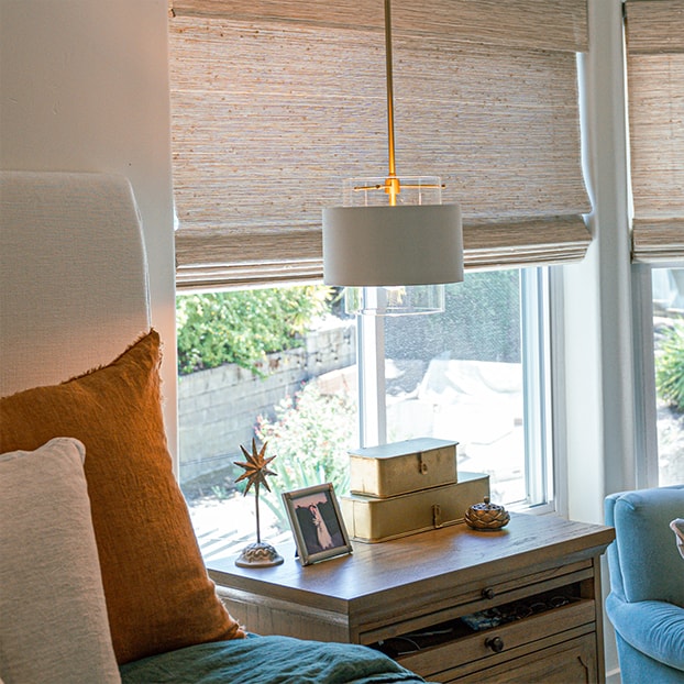A window seat with an ochre cushion