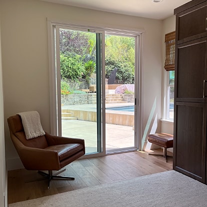 Lounge chairs beside a window