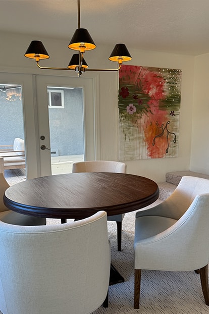 A dining table beneath a pendant